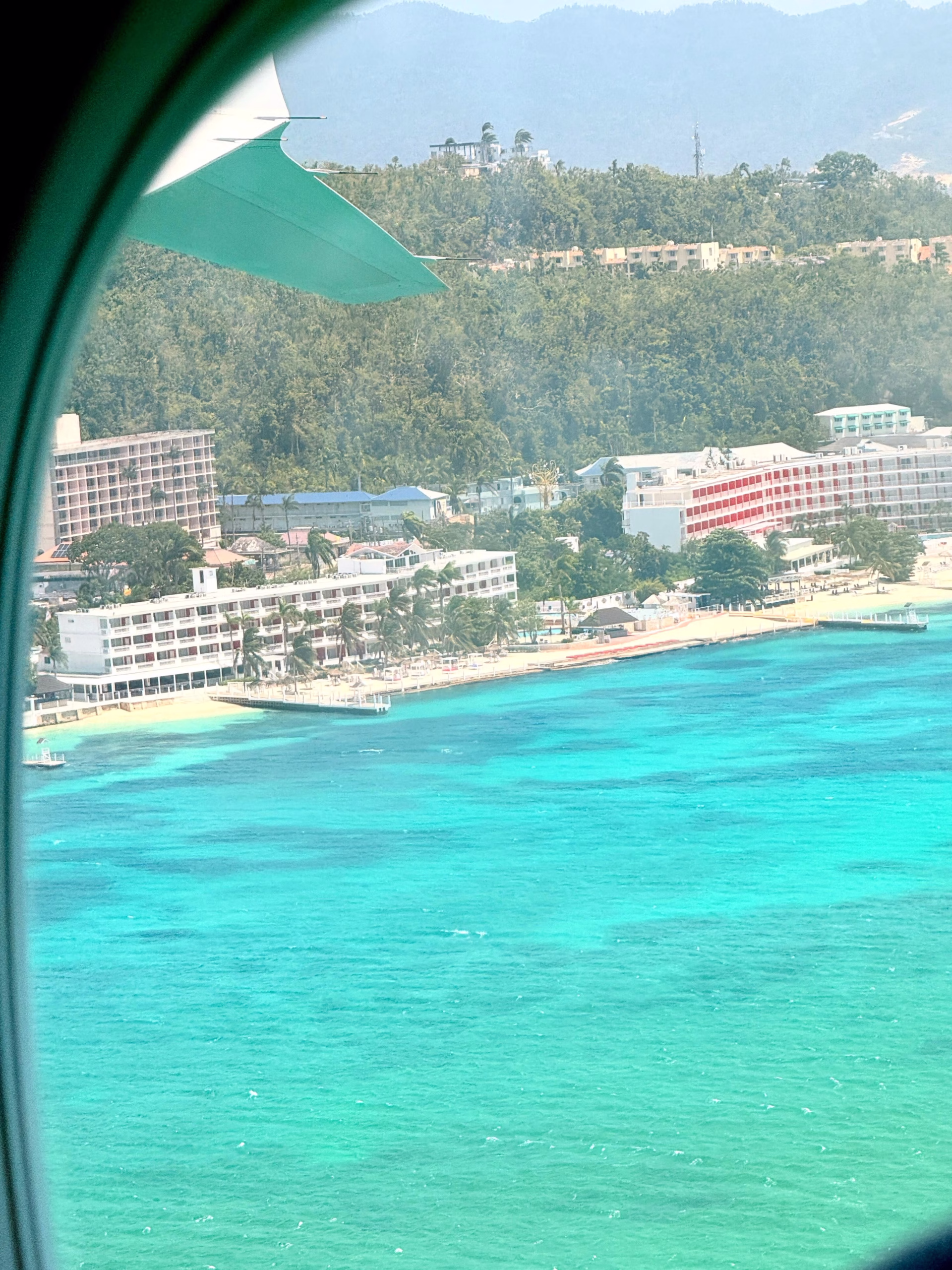 Jamaican coastline and turquoise water seen during the family's journey