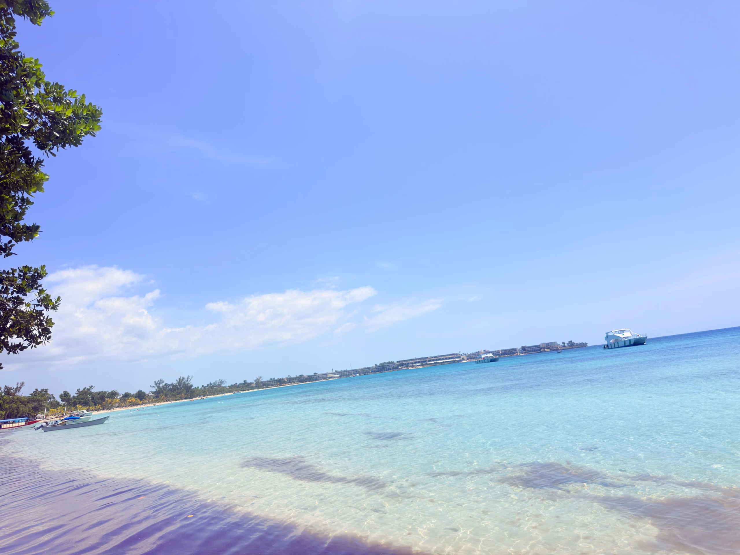 Clear shallow Caribbean water in Negril photographed during a real family holiday